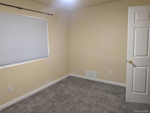 15703 E 13th Pl, Aurora, CO 80011 - carpeted spare room featuring baseboards