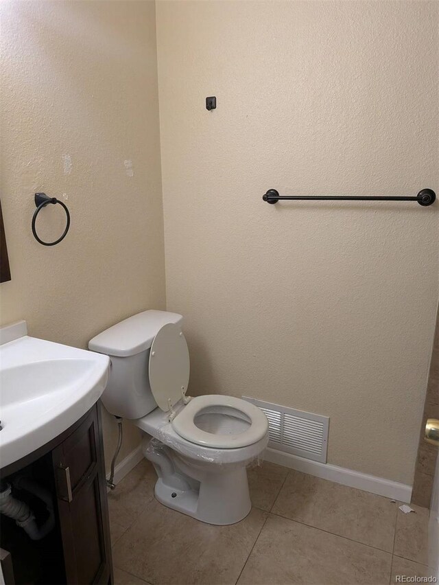 15703 E 13th Pl, Aurora, CO 80011 - bathroom featuring tile patterned flooring and vanity