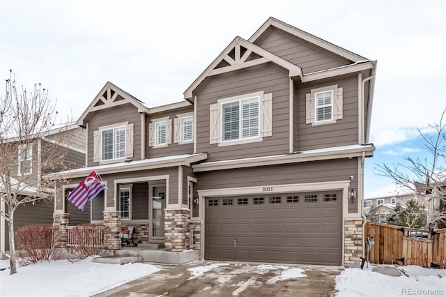 craftsman-style home with a porch and a garage