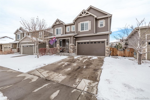 craftsman-style home with a garage and covered porch