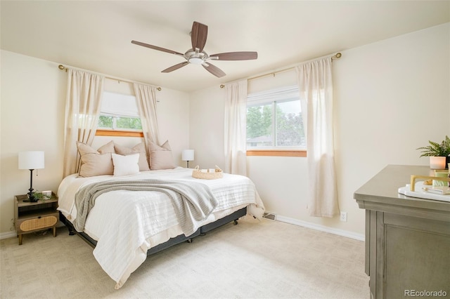 5885 S Huron St, Littleton, CO 80120 - bedroom with multiple windows, light carpet, and a ceiling fan