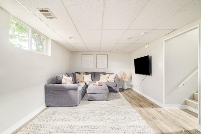 5885 S Huron St, Littleton, CO 80120 - living room with light wood finished floors and a drop ceiling