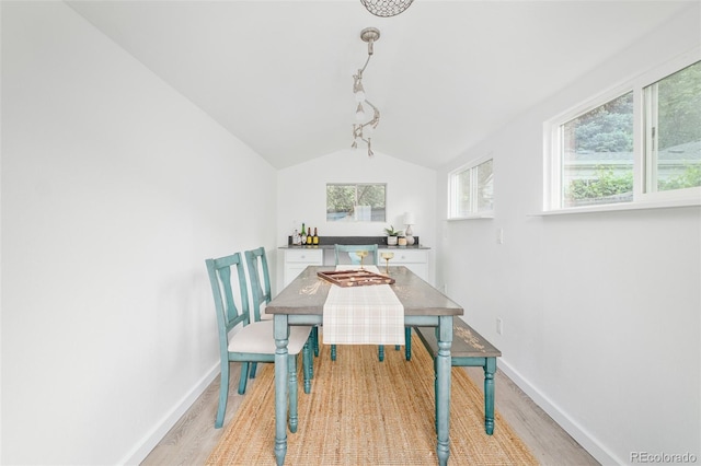5885 S Huron St, Littleton, CO 80120 - dining space featuring light wood finished floors, healthy amount of natural light, and vaulted ceiling