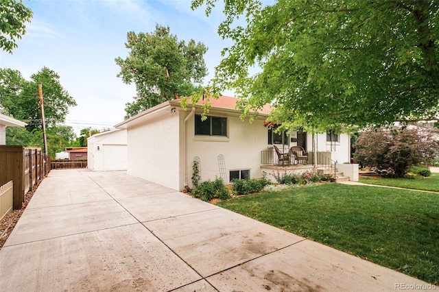 5885 S Huron St, Littleton, CO 80120 - view of front of home with covered porch and a detached garage