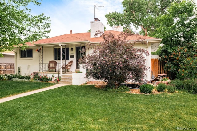 5885 S Huron St, Littleton, CO 80120 - view of front facade featuring covered porch and a chimney