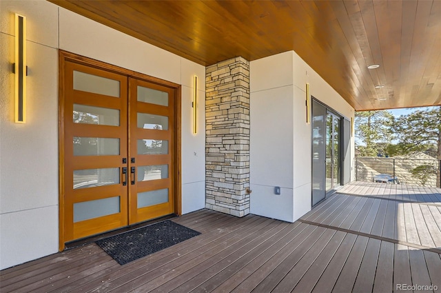 view of exterior entry featuring french doors