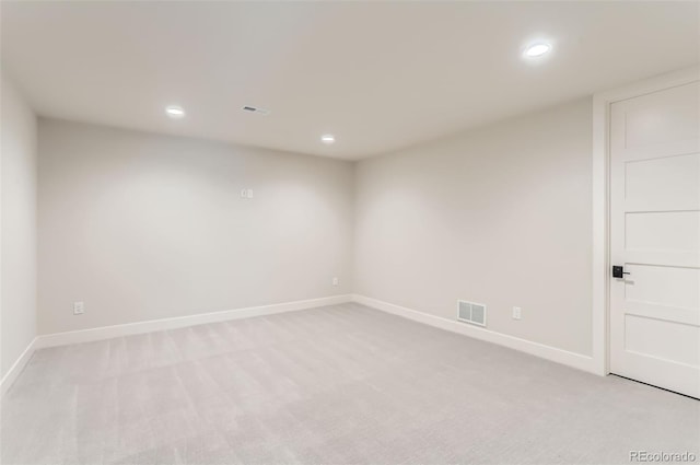 spare room with light carpet