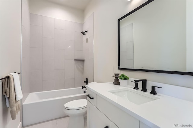 full bathroom with vanity, tile patterned flooring, tiled shower / bath combo, and toilet