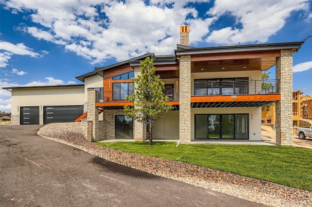 5820 Powell Rd, Parker, CO 80134 - view of property with driveway and a garage