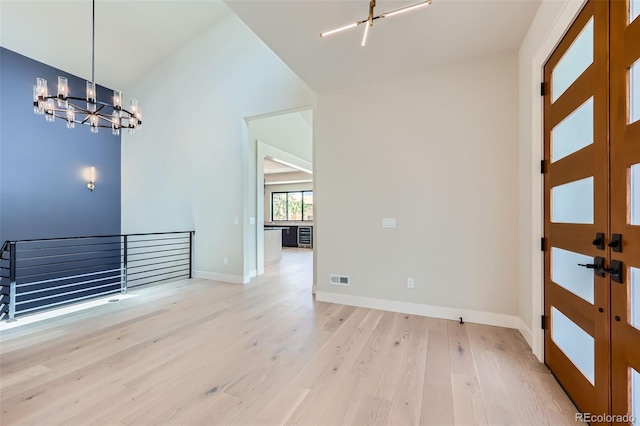 5820 Powell Rd, Parker, CO 80134 - foyer featuring a chandelier, wood finished floors, and french doors