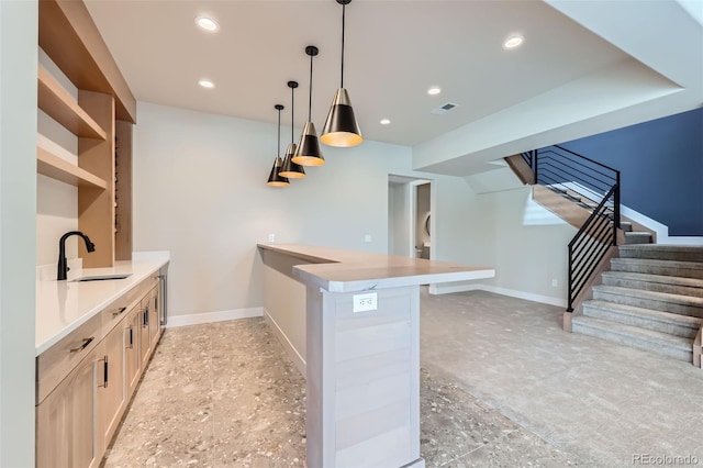 5820 Powell Rd, Parker, CO 80134 - kitchen with a peninsula, hanging light fixtures, light countertops, recessed lighting, and open shelves
