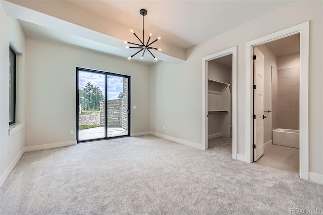 5820 Powell Rd, Parker, CO 80134 - unfurnished bedroom with a chandelier, access to outside, light carpet, and a spacious closet