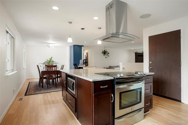 4994 S Independence Way, Littleton, CO 80123 - kitchen featuring appliances with stainless steel finishes, island range hood, light wood finished floors, pendant lighting, and light stone counters