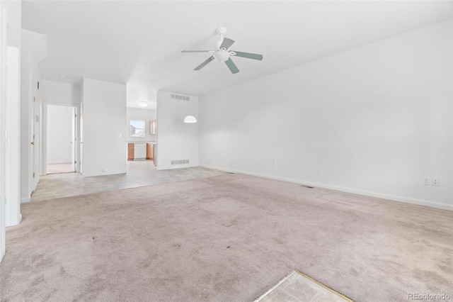 spare room with light colored carpet and ceiling fan