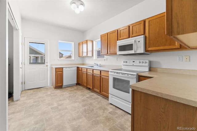 kitchen with white appliances and sink