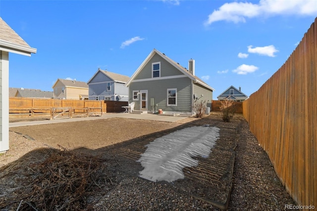 rear view of house featuring a patio