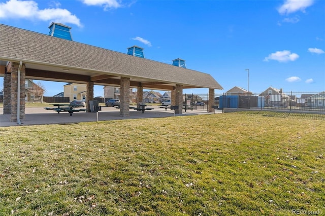 surrounding community with a gazebo and a lawn