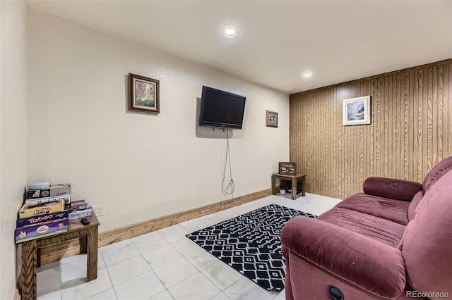 17076 Foxton Dr, Parker, CO 80134 - living area with wood walls, tile patterned flooring, and recessed lighting