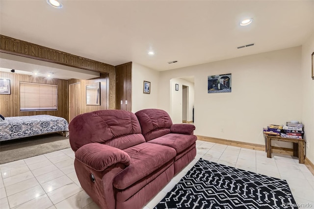17076 Foxton Dr, Parker, CO 80134 - living room with light tile patterned floors, recessed lighting, baseboards, and wooden walls
