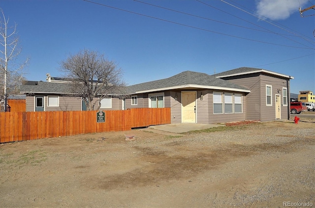 view of front of house featuring fence