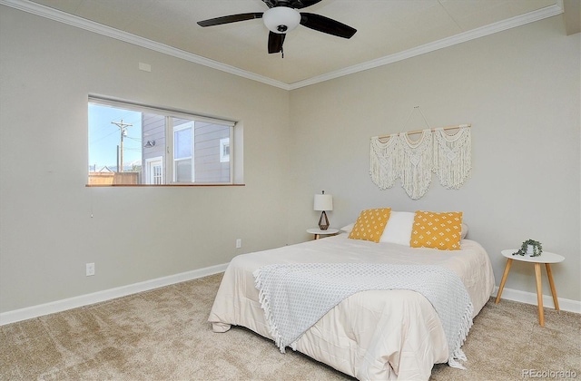 bedroom with baseboards, ornamental molding, a ceiling fan, and carpet floors
