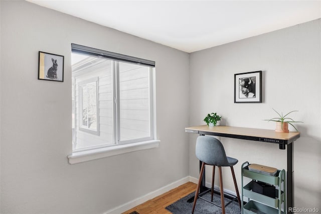 office space with hardwood / wood-style flooring