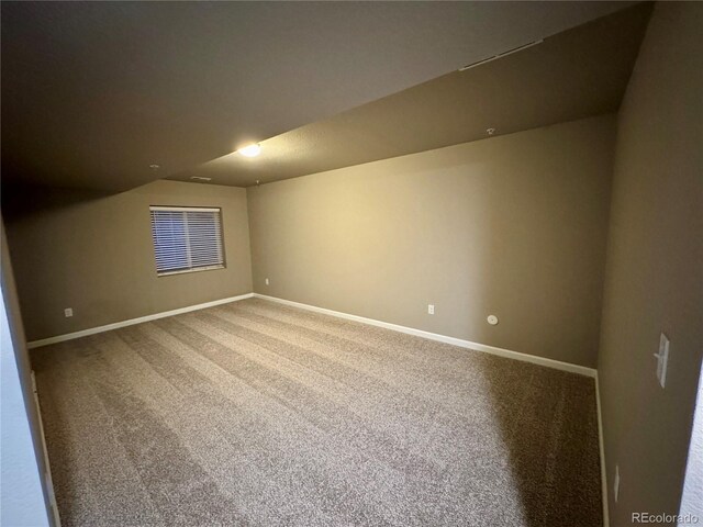 bonus room with carpet and lofted ceiling