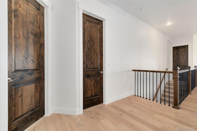 hall with light hardwood / wood-style flooring