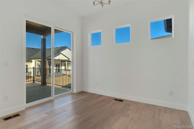 unfurnished room featuring light hardwood / wood-style flooring