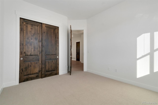 unfurnished bedroom with light carpet