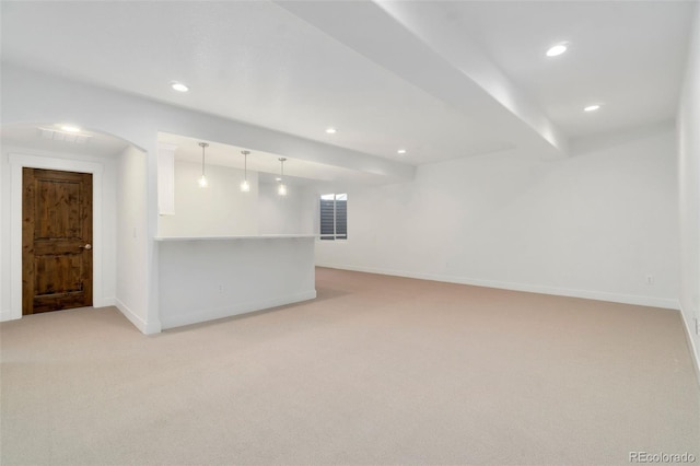 unfurnished room featuring light carpet