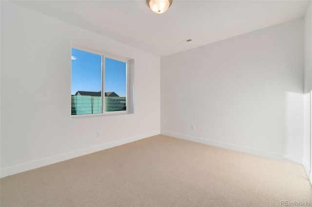 unfurnished room featuring carpet