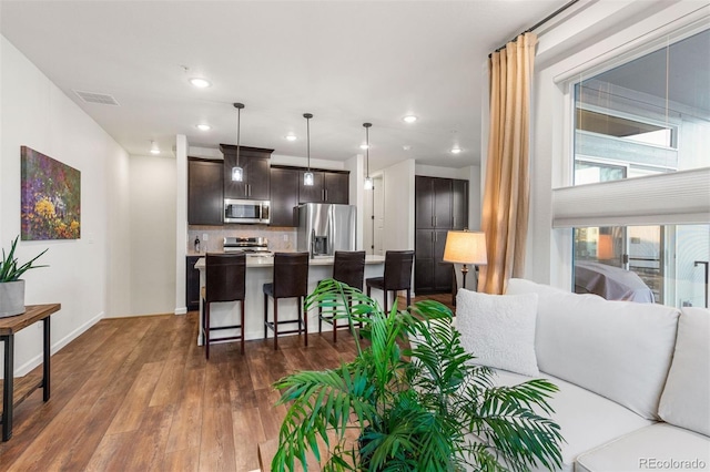 living room with dark hardwood / wood-style flooring