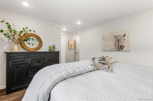 bedroom featuring dark hardwood / wood-style flooring