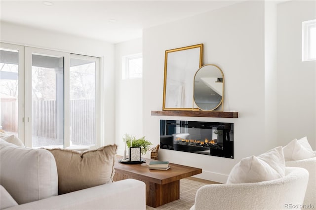 living room with a multi sided fireplace