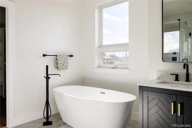 bathroom featuring a tub and vanity