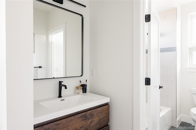 full bathroom featuring vanity, toilet, and washtub / shower combination