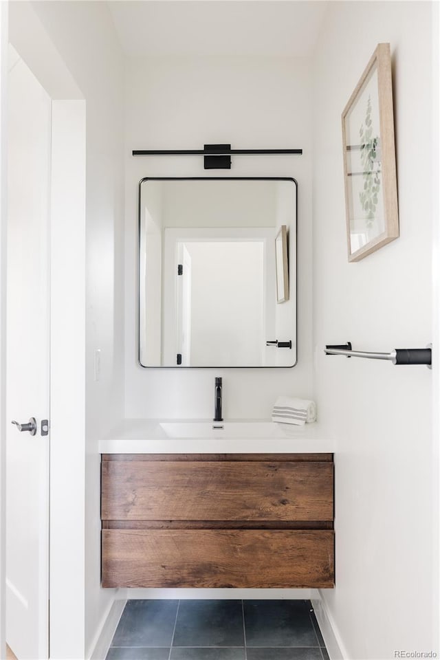 bathroom with tile patterned flooring and vanity