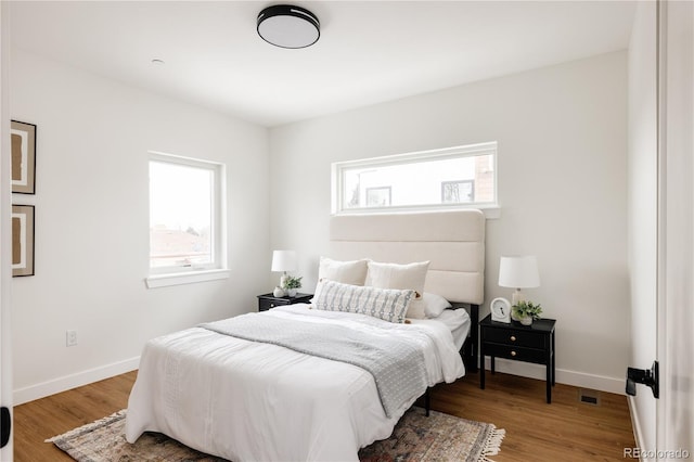 bedroom with hardwood / wood-style flooring