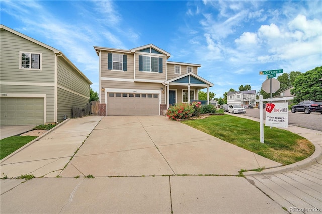 11091 Clayton St, Northglenn, CO 80233 - craftsman-style home with brick siding, a garage, a front yard, and driveway