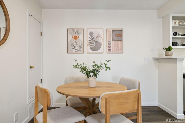18391 E Kepner Pl Unit 205, Aurora, CO 80017 - dining area with baseboards and dark wood finished floors