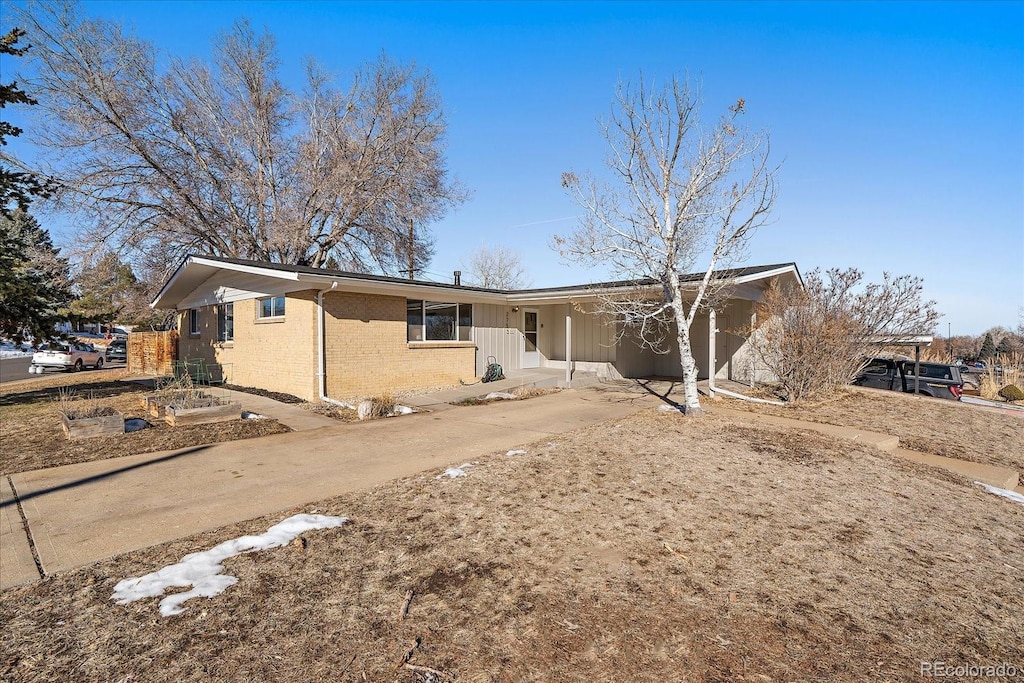 view of front of home featuring a carport