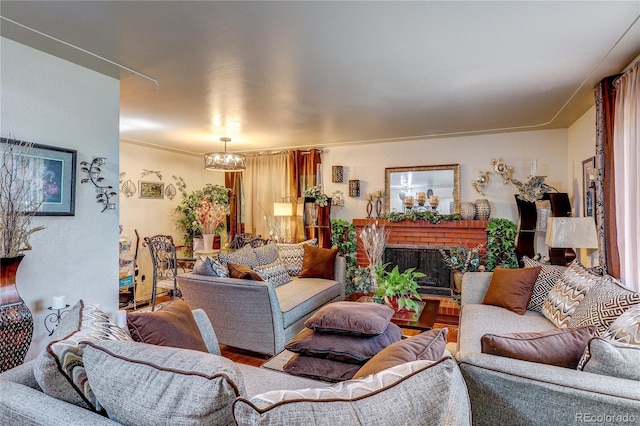 233 Nome St, Aurora, CO 80010 - living room featuring a chandelier, wood finished floors, and a fireplace