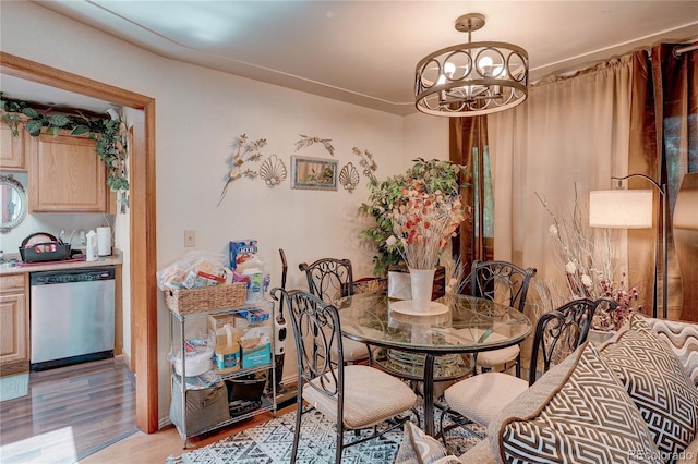 233 Nome St, Aurora, CO 80010 - dining room with a chandelier and light wood-style flooring