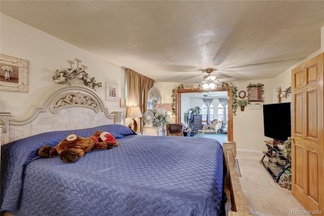 233 Nome St, Aurora, CO 80010 - bedroom with light colored carpet, a textured ceiling, and a ceiling fan