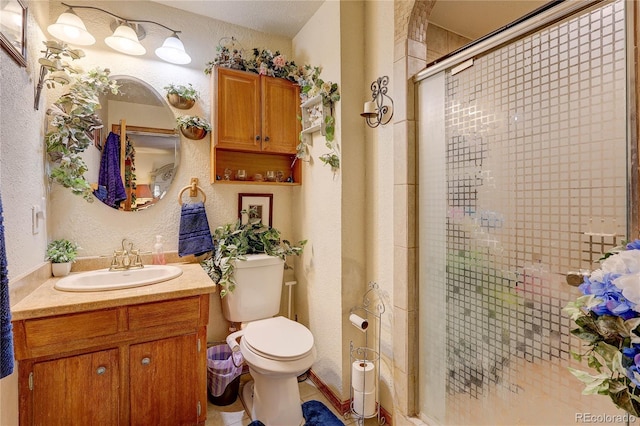 233 Nome St, Aurora, CO 80010 - bathroom featuring vanity, a shower stall, and a textured wall