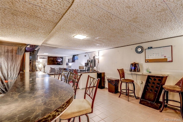 233 Nome St, Aurora, CO 80010 - tiled dining area featuring a bar