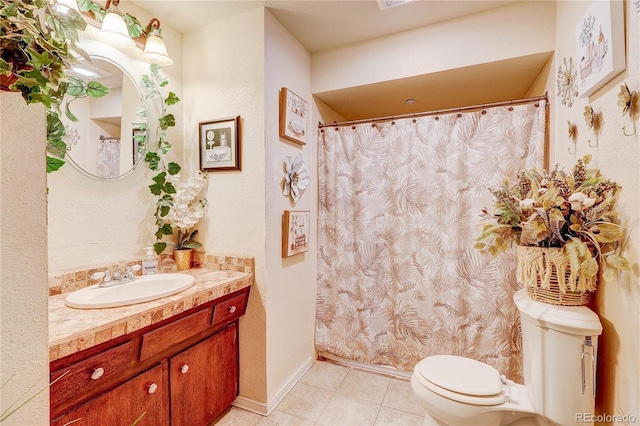 233 Nome St, Aurora, CO 80010 - bathroom with vanity, tile patterned floors, and a shower with curtain