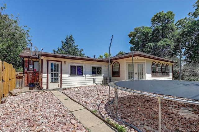 233 Nome St, Aurora, CO 80010 - back of house featuring french doors and a trampoline