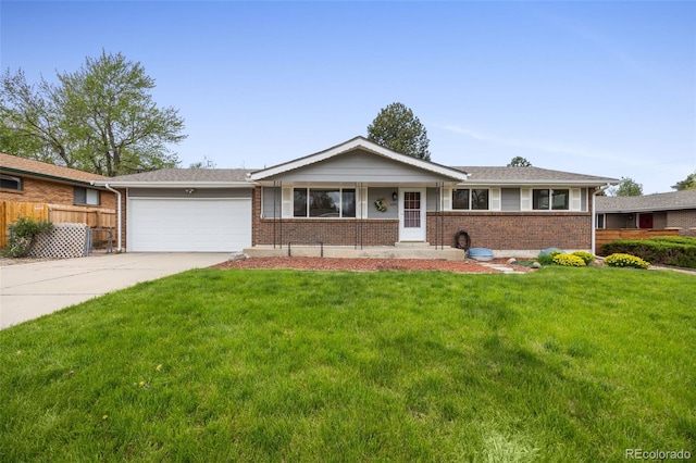 1185 Yank St, Golden, CO 80401 - ranch-style house featuring brick siding, a garage, and driveway